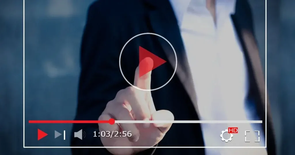 A man's hand pressing the icon of YouTube showing Video Marketing